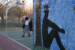 Basketball players near the Shipe Park mural