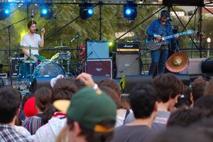 A band on stage at a music festival